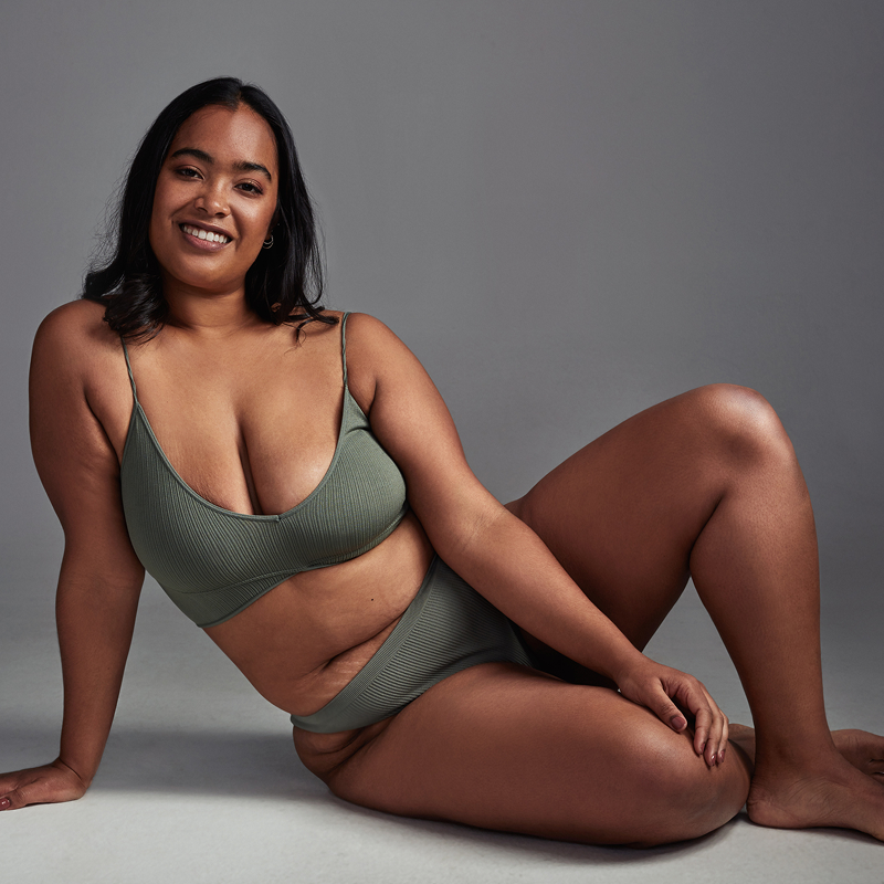 Dentist examining patient with mirror reflection.