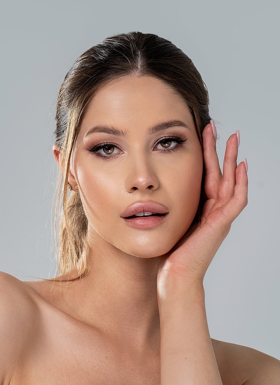 Portrait of a woman with flowing blonde hair.