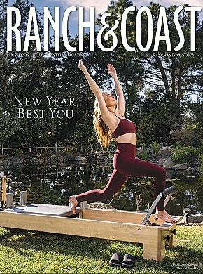 Woman exercising on a reformer by a pond.
