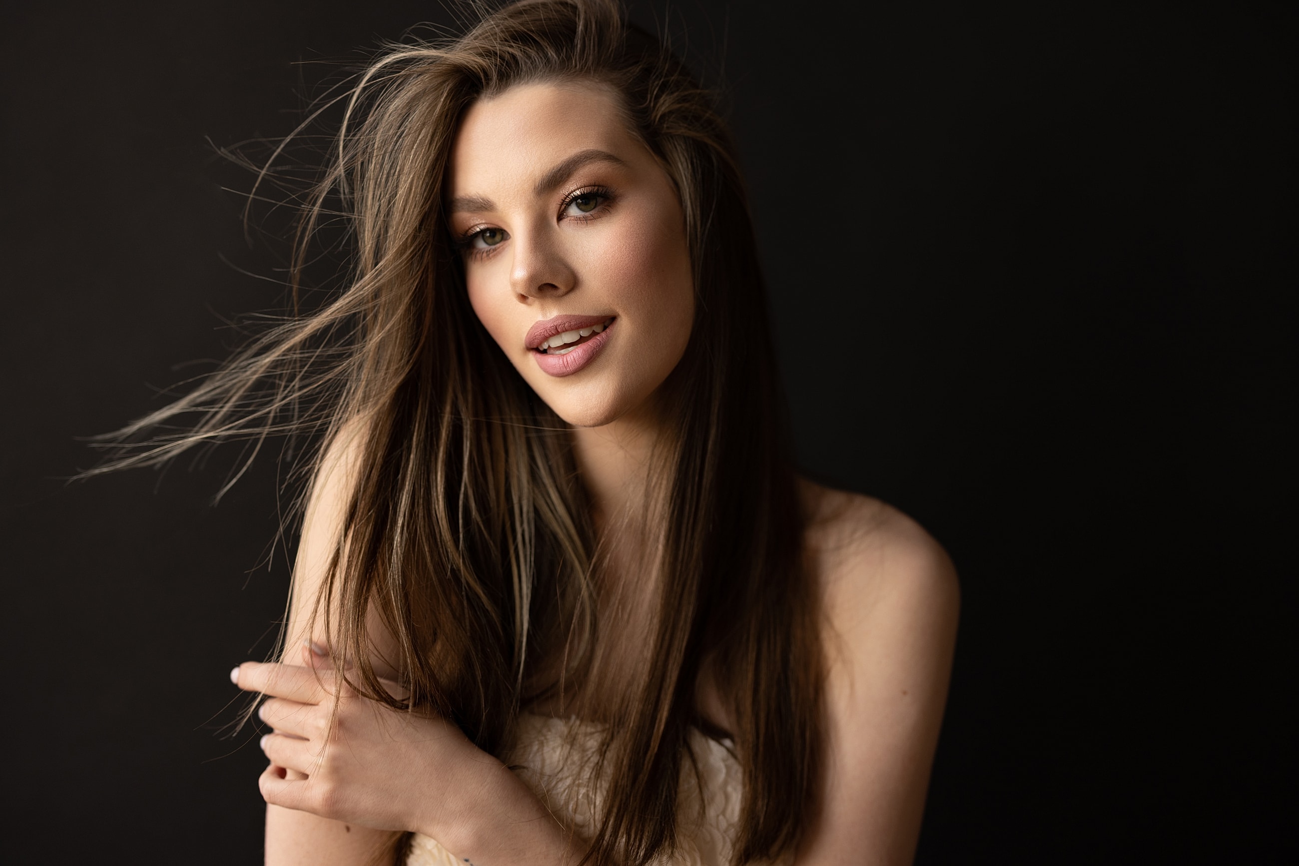 Smiling medical professional in surgical environment.