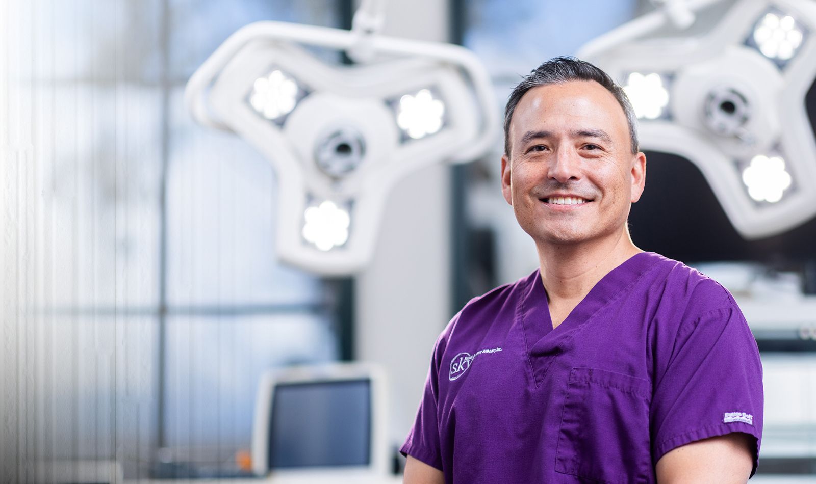 Model with tousled hair and expressive gaze.